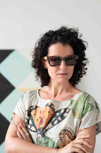 Eleanor in sunglasses, insect print shirt