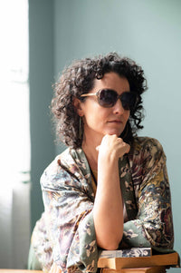 Woman in floral kimono & sunglasses