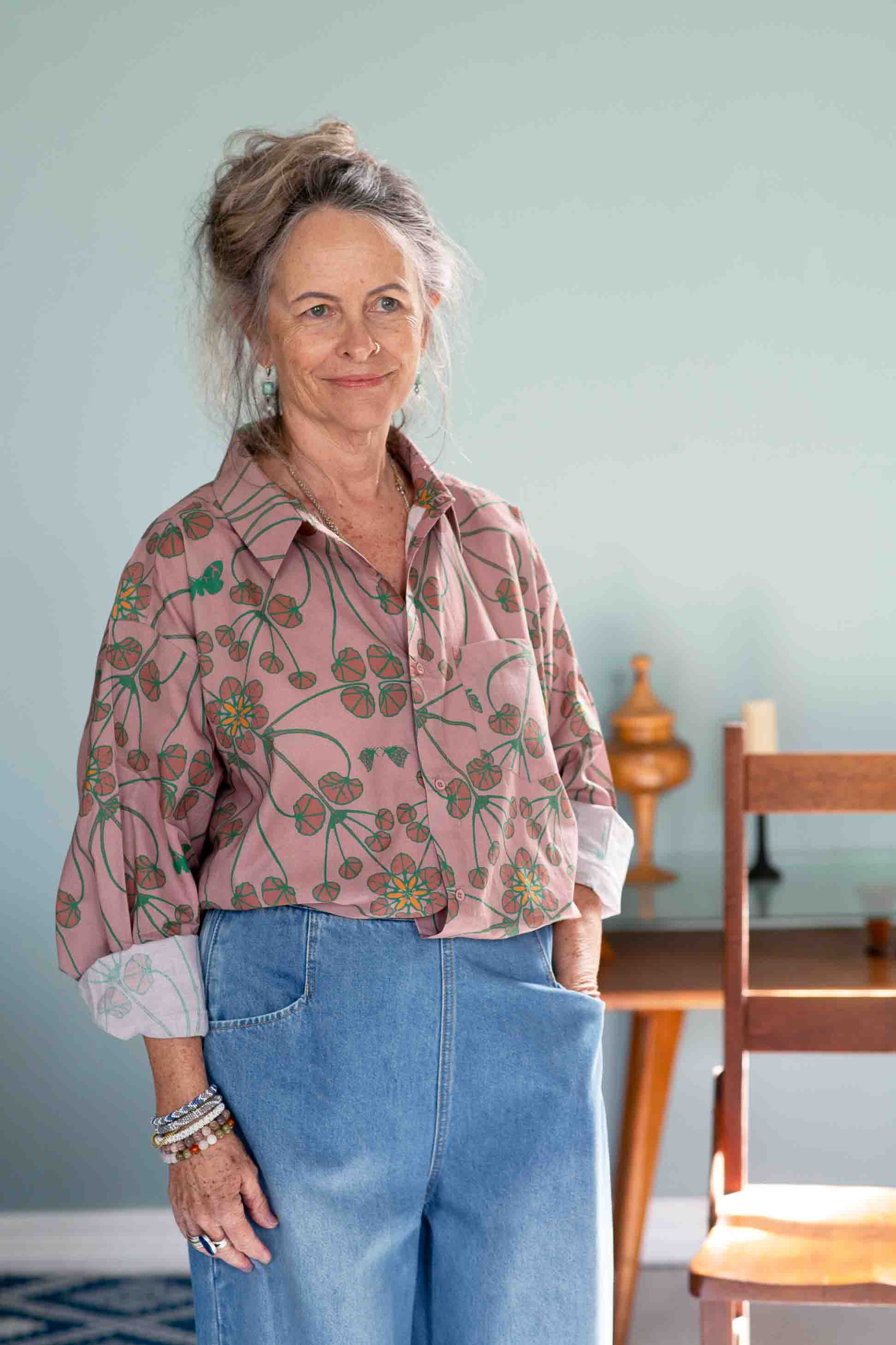 Woman in floral shirt and denim jeans