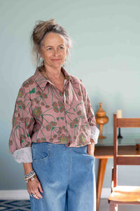 Woman in floral shirt and denim jeans