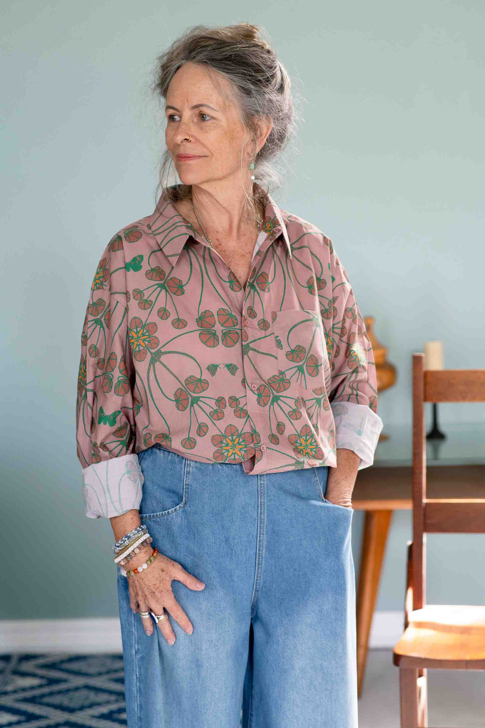 Woman in TedTerraOllie denim outfit, floral shirt