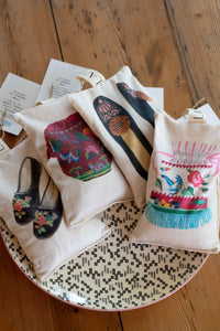 Closet scented sachets with shoe designs on a tray