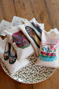 Closet scented sachets with shoe designs on a tray