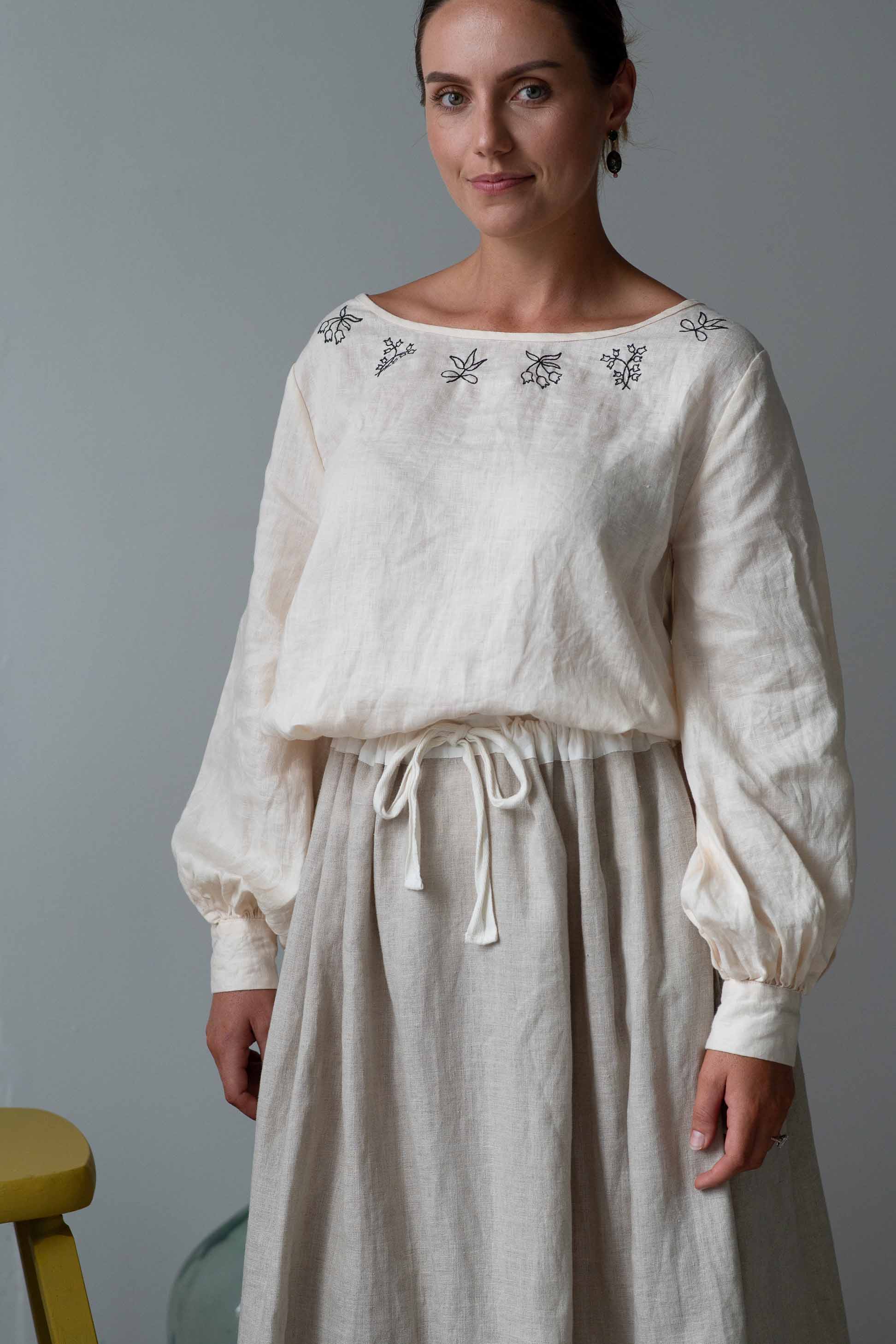 Valeria in cream Fion skirt, long-sleeved blouse with embroidery
