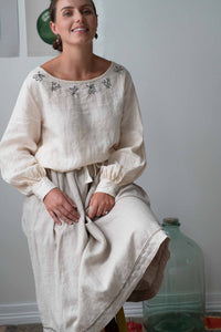 Woman in cream Fiona skirt and embroidered top