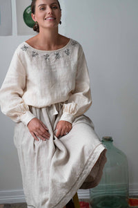Woman in cream Fiona skirt and embroidered top
