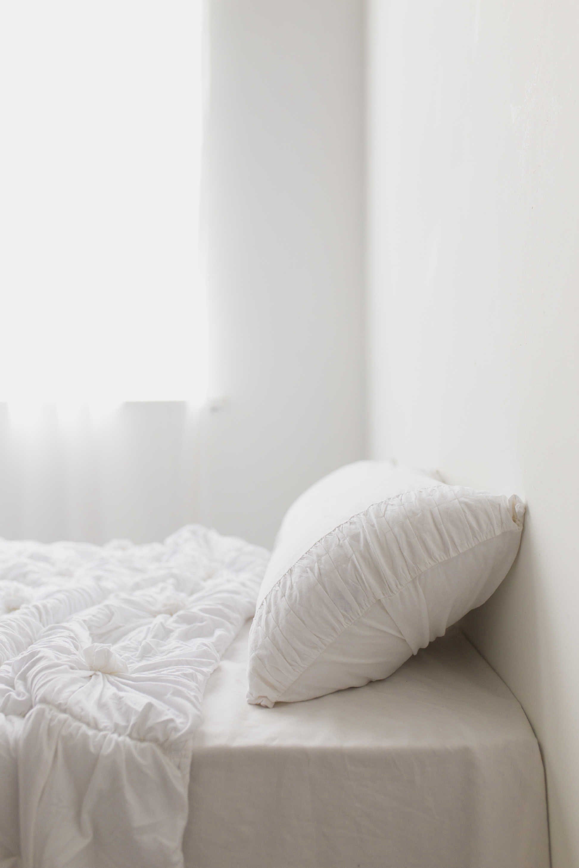 White rosette quilt pillowcase set on bed