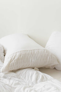 White rosette pillowcase set on bed