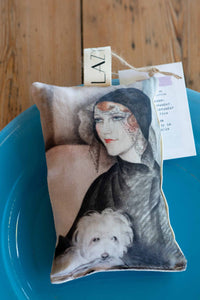 Young woman on scented sachet with dog