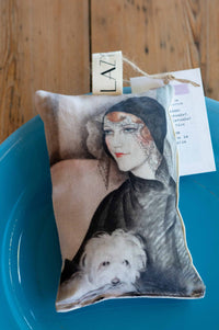 Young woman on scented sachet with dog