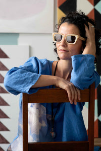 Zahra wearing sunglasses, posing in front of clouds, DSC1208