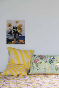 Still life painting of flowers and pillows on bed