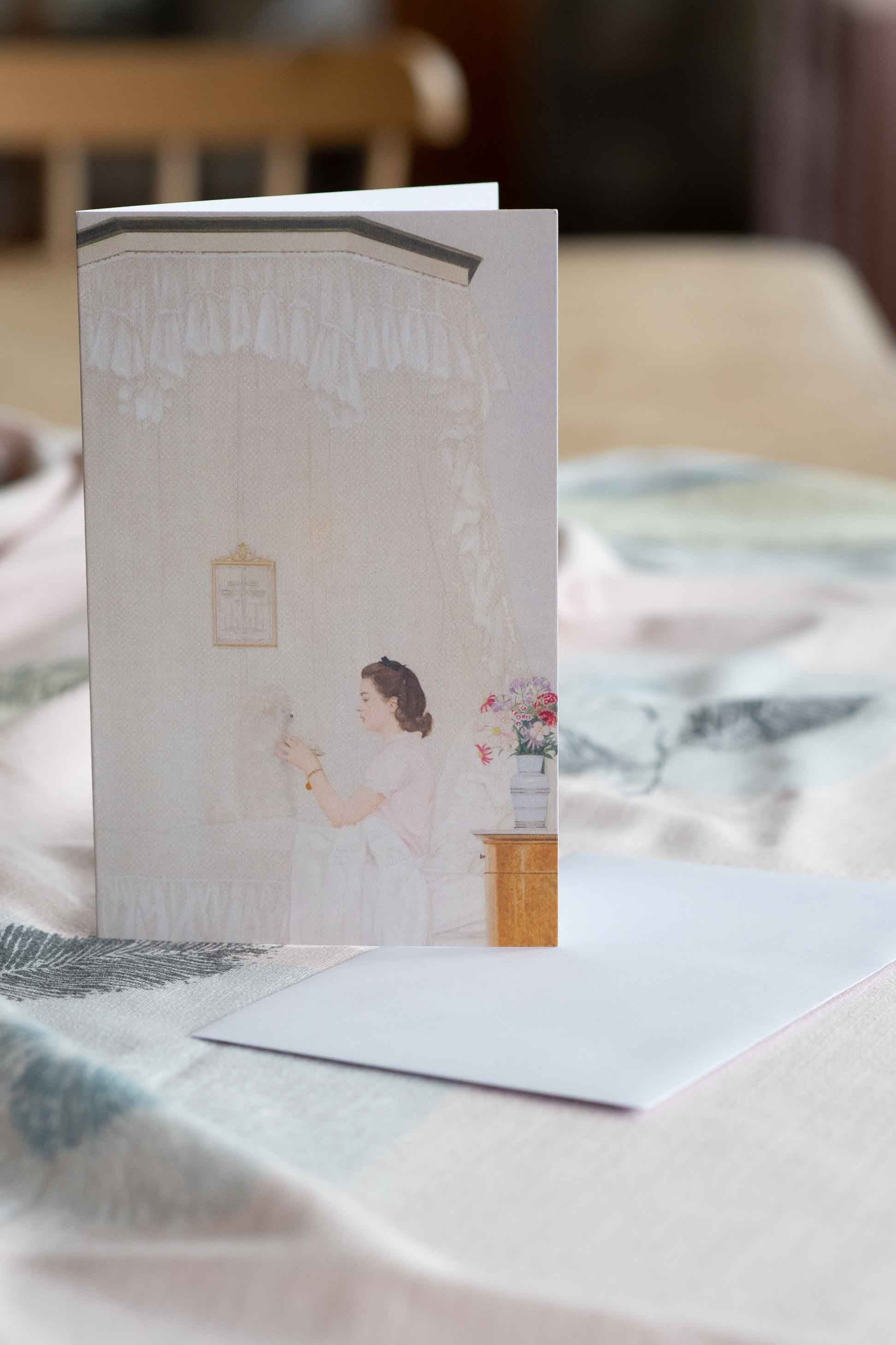 Sylvie card with illustration of woman and dog.