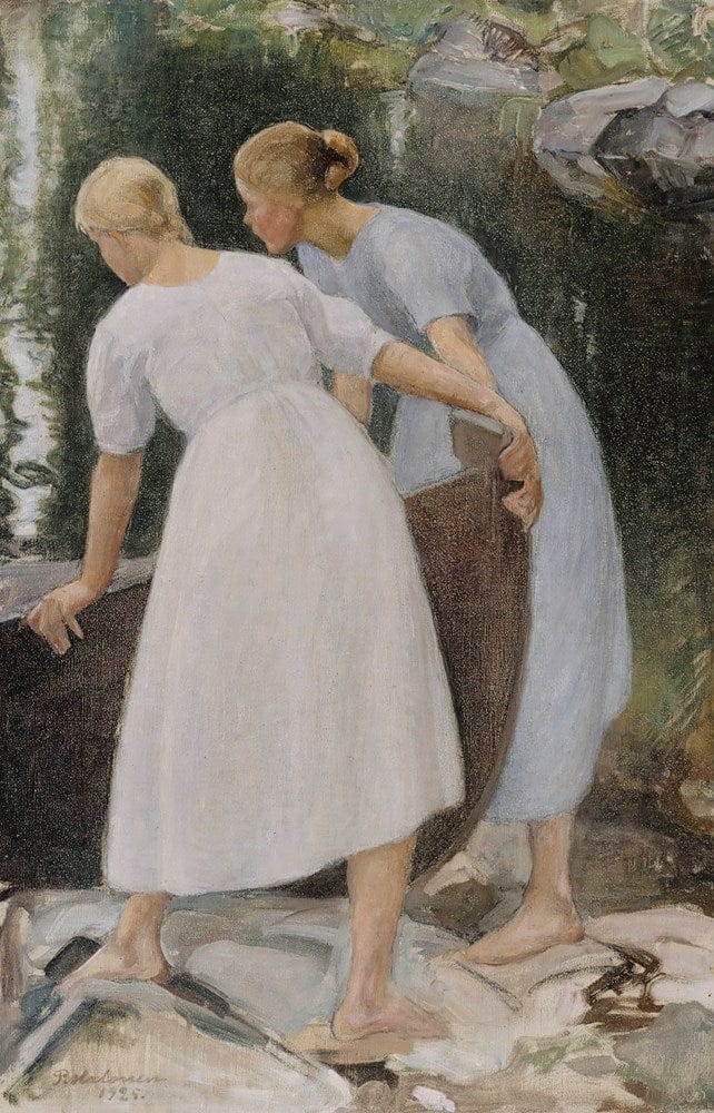 Two women by water, holding a boat.