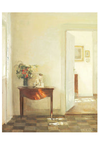 Table with flowers and open door.