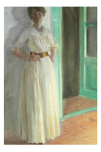 Woman in white dress standing near a green door.