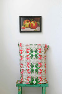 Art print of apples above pelargonium pillowcase.