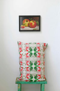 Art print of apples above pelargonium pillowcase.