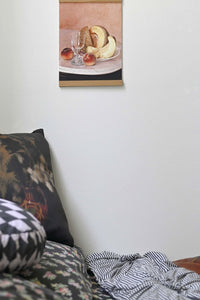 Art print of cantaloupe, peaches, bread, & glass on a plate.