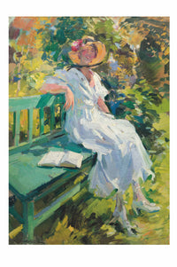 Woman in white dress relaxing in garden