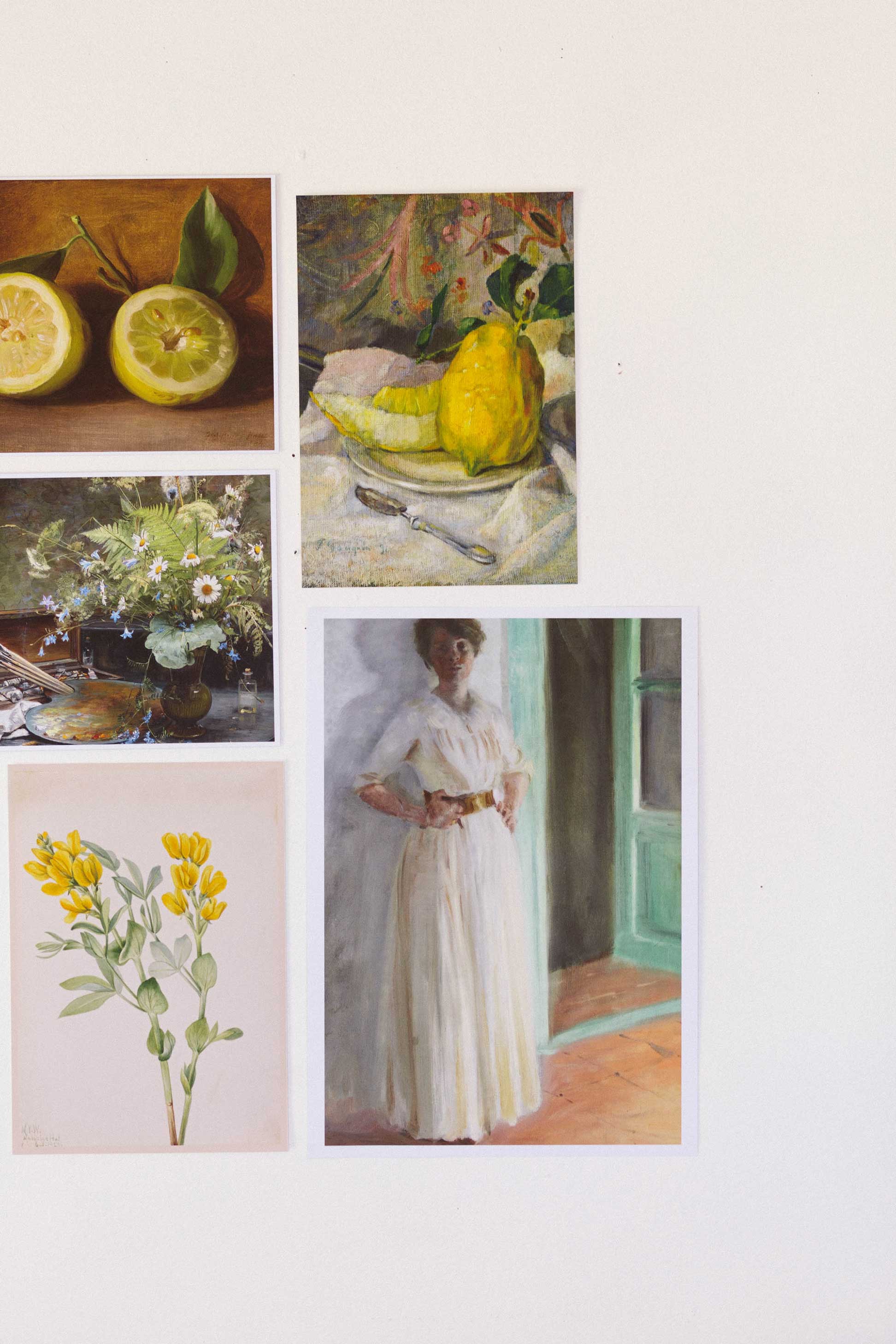 Art prints of lemons, flowers, and woman.