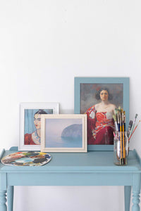 Blue Light Art Prints on a blue table with Frida Kahlo portrait