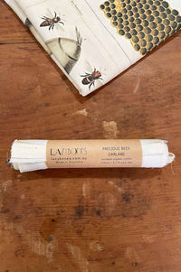 Precious Bees Garland packaging with bee illustrations.