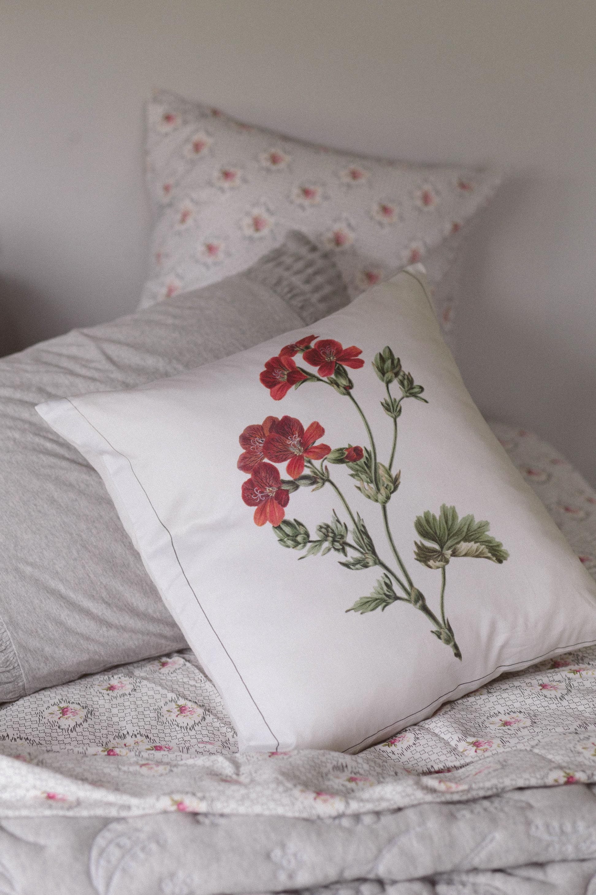 Geranium cushion cover on grey Vienna sheet set