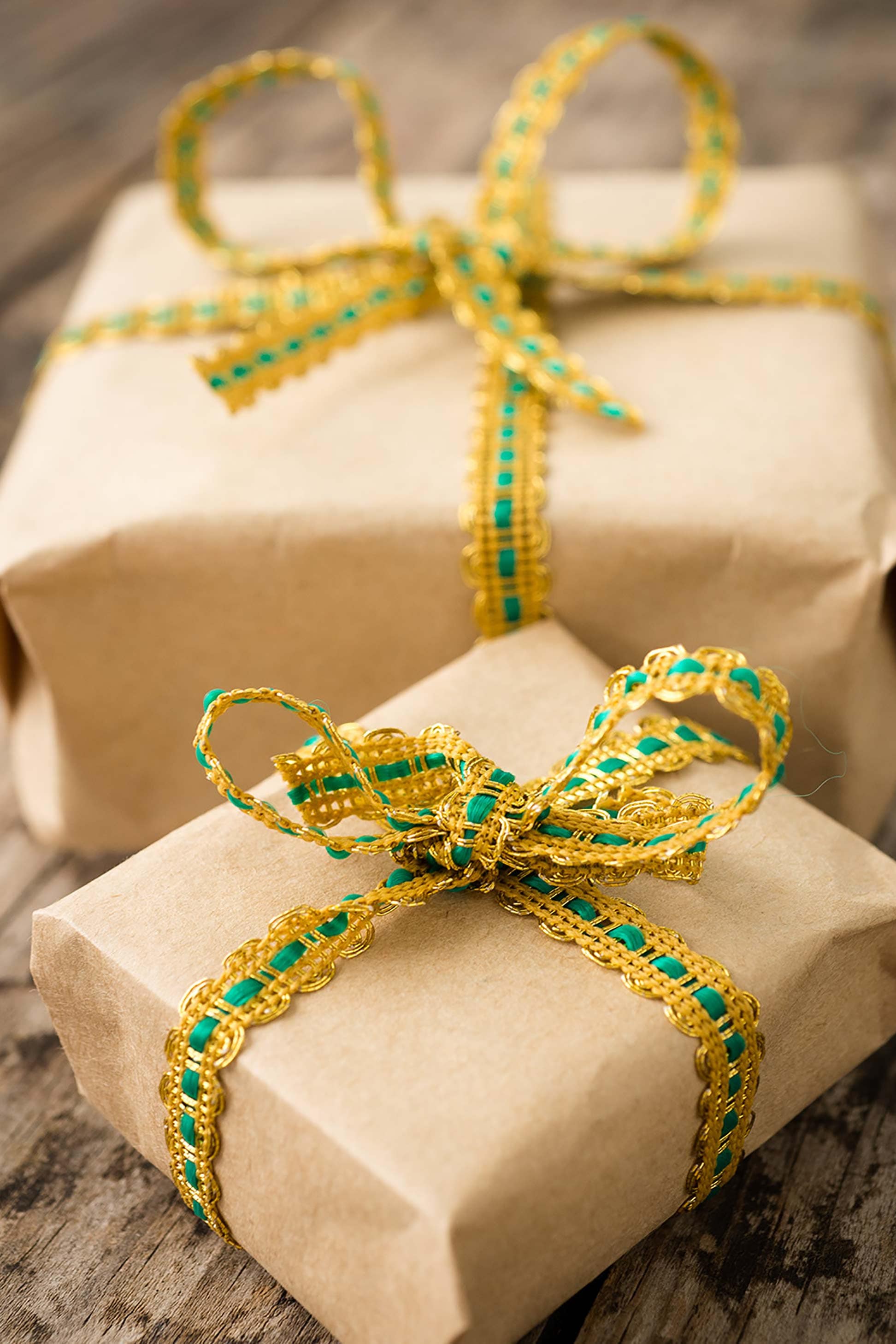 Wrapped gifts with gold and green ribbon