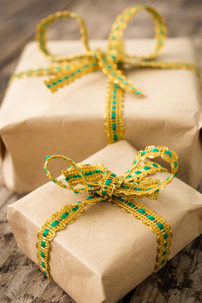 Wrapped gifts with gold and green ribbon