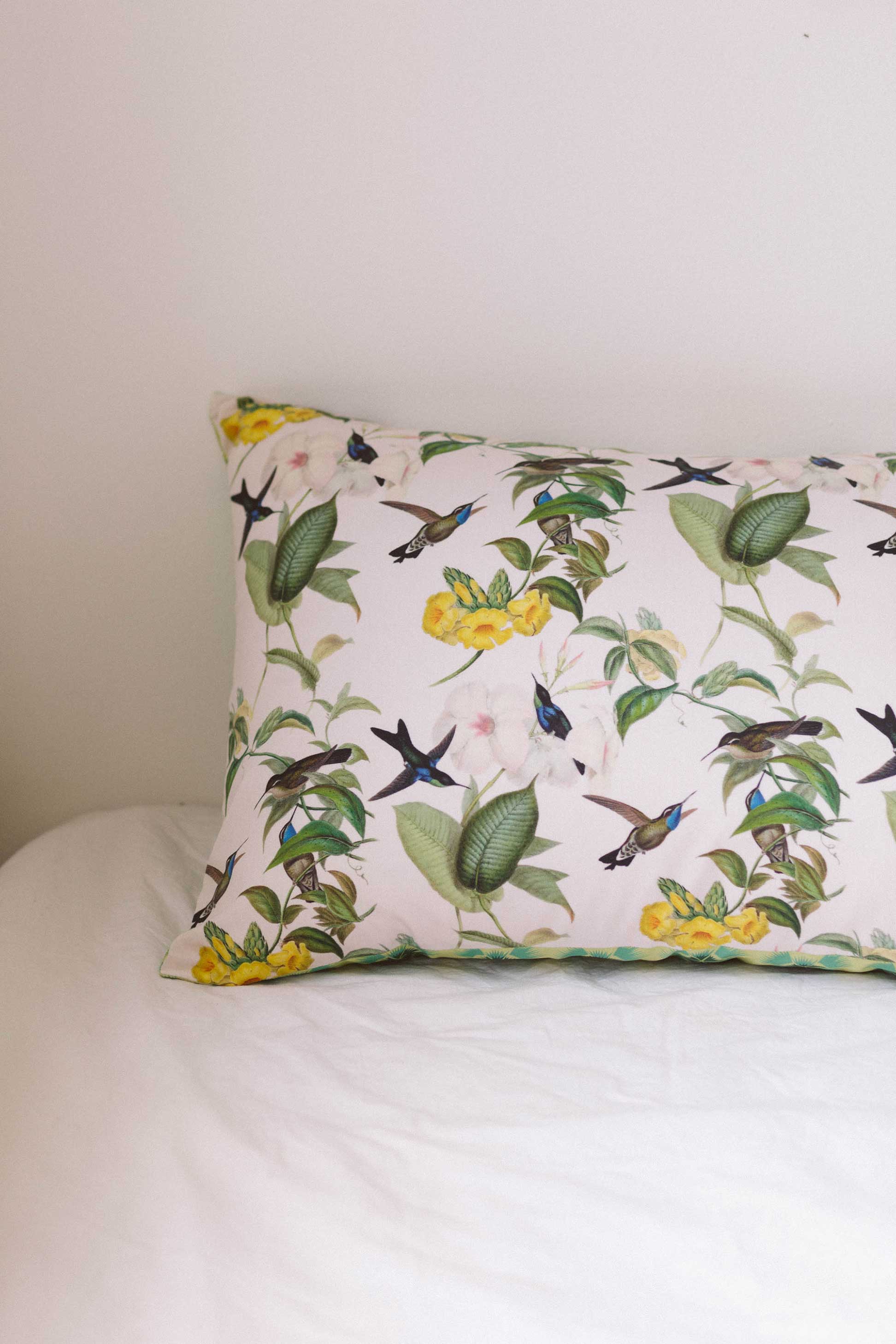 Hummingbird pillowcase set with floral and bird pattern.