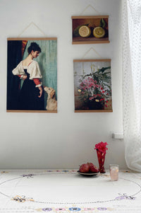 Lemons & other art prints hanging on wall.