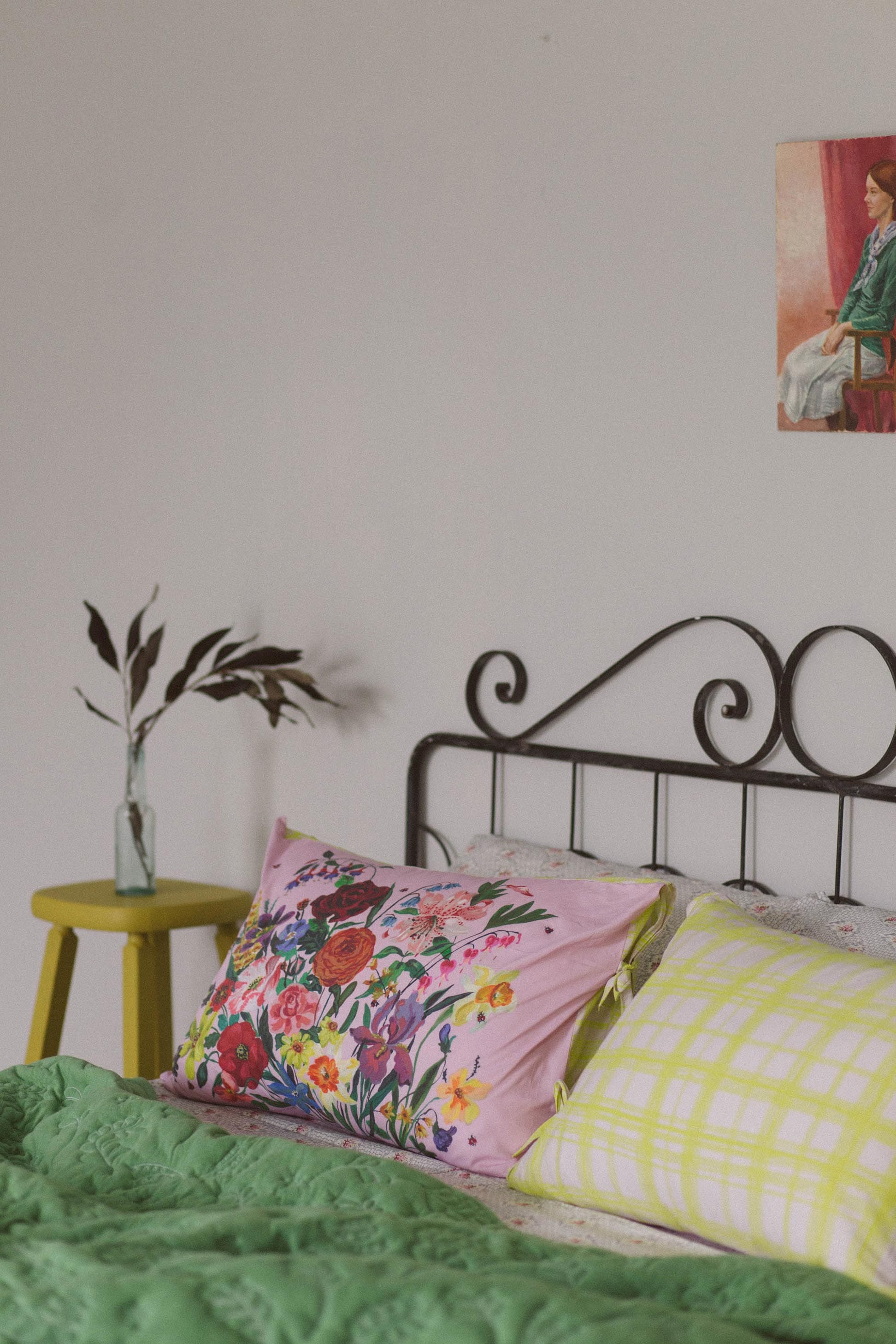 Pink floral pillowcase set on bed.