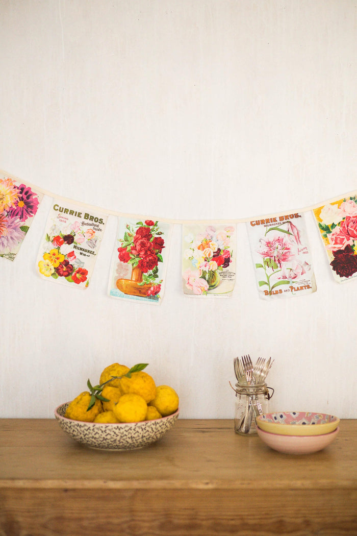 Vintage flower garland with fruit and bowls.
